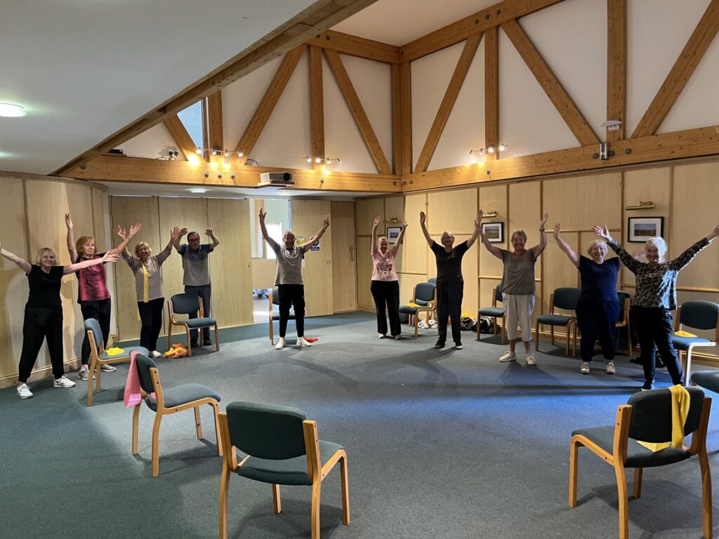 Members stretching up.