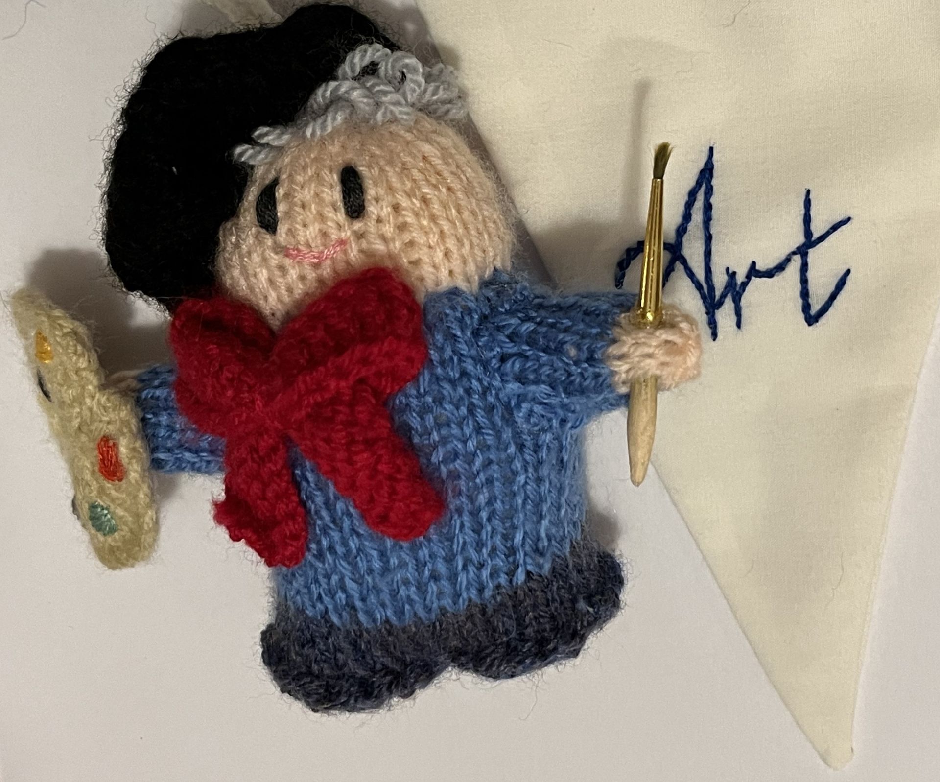 A knitted artist.