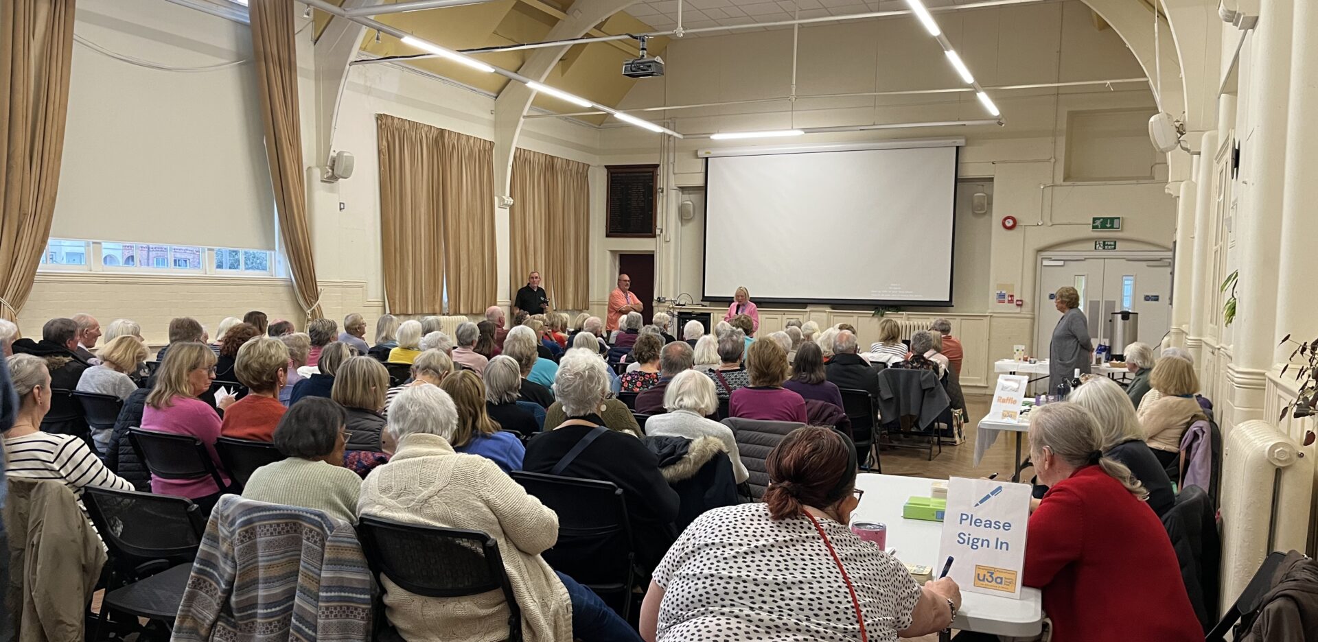 People at a monthly meeting in Newhaven